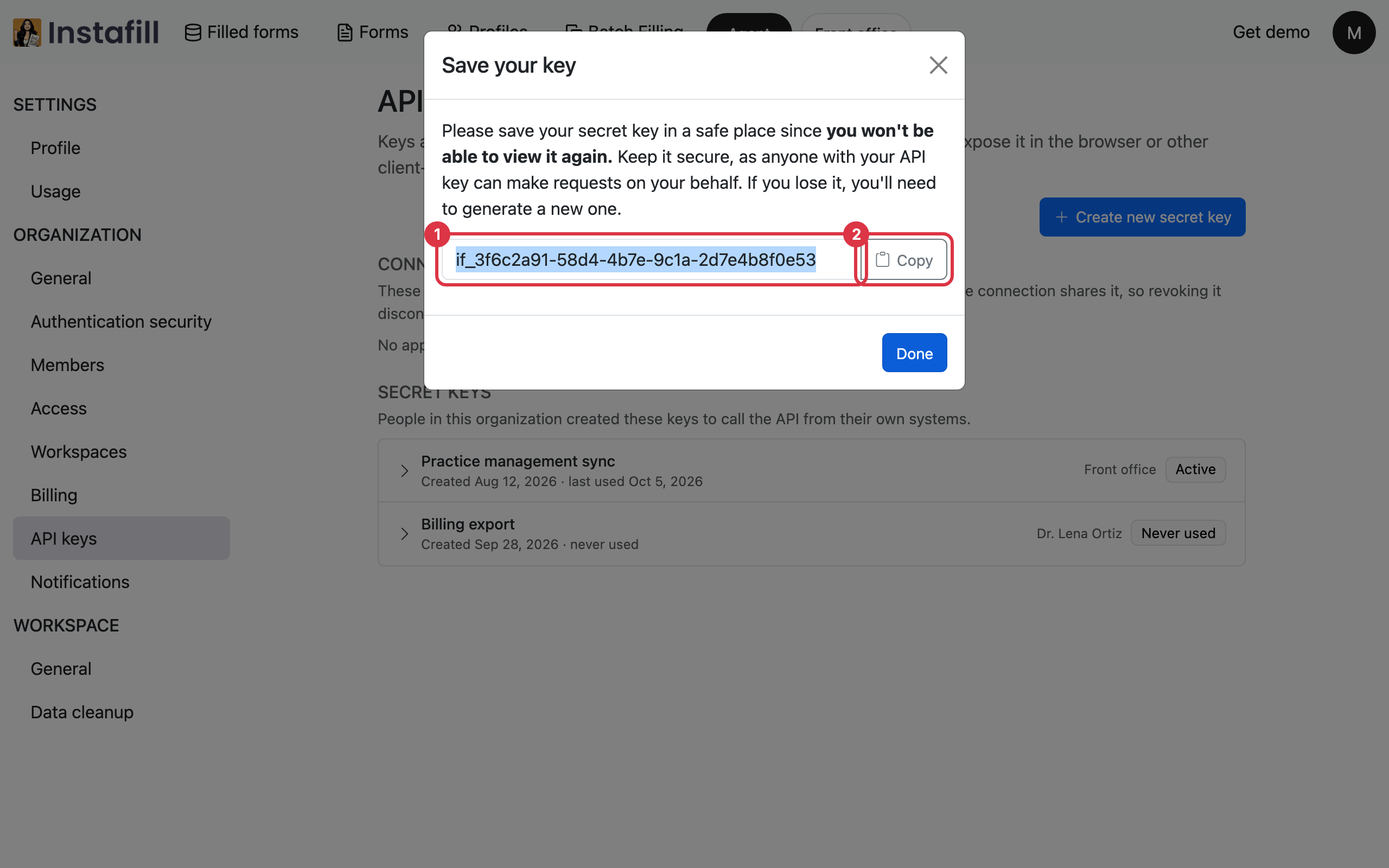 The Save your key window showing a new secret key with a Copy button